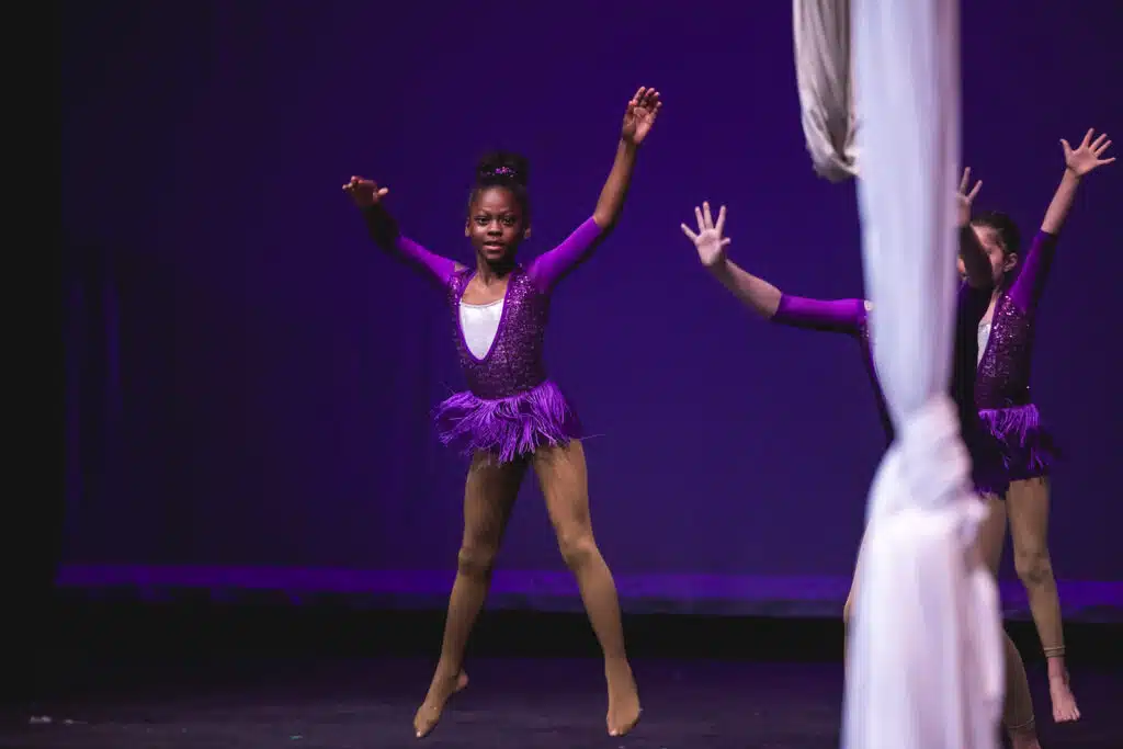 Child jumping during a performance